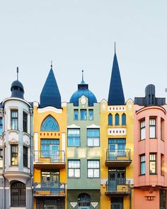 a row of multi - colored buildings in front of each other