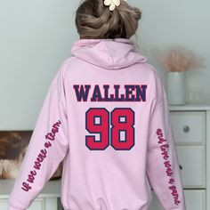 Our own twist on the viral '98 Braves Morgan Wallen Hooded Sweatshirt is here! You will stand out from the crowd with our version because of the stylish lyrics located on the sleeves! "if we were a team, and love was a game"  This hoodie comes in a variety of colors for your personal preference and we offer these in sweatshirts and t shirts as well!  SIZING: Gilden fits true to size. We suggest that you order the next size up for the trendy, oversized look. SHIPPING: Production Time: 1-3 days Shipping Time: 2-7 days SHOP MESSAGE: Thank you for choosing TheTimelessTinker! We take great pride in creating high-quality products that are both beautiful and functional, and we are thrilled that you have chosen to add one of our items to your collection. Shop our whole collection below! https://ww 98 Braves, Were A Team, Atlanta Braves Jersey, Braves Jersey, Braves Shirts, Braves Baseball, Morgan Wallen, Cowboys Shirt, Baseball Jersey