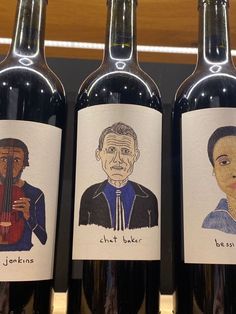 three bottles of wine with pictures of people on them