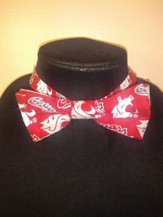 "This pre-tied and self-tie adjustable size bow tie is a perfect accent for any collared shirt! This bow tie can fit a child as young as three years old up to an adult with an 18\" neck size, even a dog or cat! *Finished print layout may vary from featured photo. **This is not a licensed product. Please note for UW, WSU, and Oregon bow ties- fabric prints have been updated as of May, 2020 The bow ties will be made with the new logo print fabrics featured in the photo next to the finished bow tie Adjustable White Bow Tie, White Adjustable Standard Bow Tie, Pre-tied Bow Tie, Pre-tied Butterfly Knot Bow As Gift, White Adjustable Bow Tie Suit Accessories, Pre-tied Bow Tie With Butterfly Knot As Gift, Pre-tied Butterfly Knot Bow Tie Gift, Adjustable Butterfly Knot Tie, Adjustable Pre-tied Bow Tie