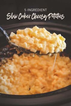 a spoon full of macaroni and cheese being scooped from the crock pot