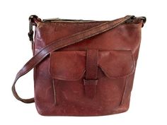 "Offering a vintage 1970's all leather shoulder bag with thick cognac brown leather. This bag features a zip top opening and a front flap with leather strap closure. The interior appears to be cowhide leather. Rectangular brass  hardware hold the straps. Zipper pull is marked \"DOVE\". Lots of character in this old bag. It has been very much pre-loved but still has plenty of life left for your enjoyment. CONDITION Bag is still in good condition showing wear consistent with age and usage, all adding to it's weathered time worn look that cannot be replicated in today's products.  Leather is distressed with scuffs, scratches corner wear. Strap shows lots of wear as does the leather rings that attach to the brass hardware that hold the strap. Zipper catches a bit but still is functional. No ri Vintage Distressed Brown Bag For Everyday, Distressed Brown Vintage Shoulder Bag With Leather Backing, Vintage Distressed Brown Bags With Waxed Finish, Vintage Brown Leather Shoulder Bag With Waxed Finish, Leather Rings, Distressed Brown Waxed Finish Shoulder Bag, Leather Ring, Shetland Wool, Roll Neck Sweater