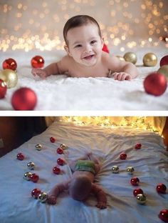 a baby laying on top of a bed next to christmas decorations and balls in the air