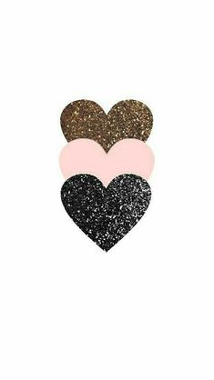 three hearts with different colors and sizes on them, one is pink, the other is black