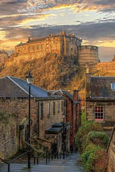 an image of a castle that is on the top of a hill in the city