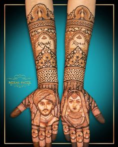 two hands with henna designs on them