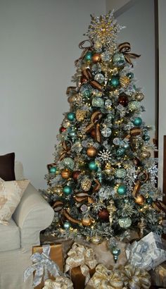 a decorated christmas tree with presents under it