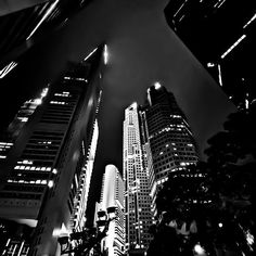 black and white photograph of skyscrapers at night