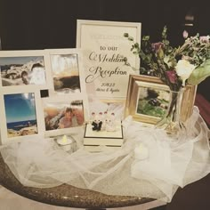 a table topped with pictures and flowers on top of it