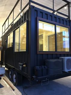 a small black container sitting inside of a building