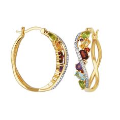 Gold-plated Multicolor Multigemstone and Diamond Hoop Earrings  These unique, criss-cross hoop earrings feature a rainbow of colorful gemstones set off with the chic sparkle of white diamond and sapphire accents. The luxe mix of semi-precious stones includes beautiful blue topaz, purple amethyst, red garnet, orange citrine and green peridot.       Measures approx. 29.5mm x 7.6mm     Stamped .925; 18K yellow gold plating     Pierced with joint-and-catch closures     Hoop earrings have criss-cross design     Front side of hoops feature multicolored gemstones     Curved piece on front lined with round, created white sapphires and white diamond accents   Stone Information       All sizes and weights approximate     Blue Topaz - Oval-cut; 2pcs; 0.51cts     Amethyst - Faceted round; 2pcs; 0.08ct Multicolor Fine Jewelry Hoop Earrings As Gift, Fine Jewelry Gemstone Hoop Earrings, Elegant Multi-stone Hoop Jewelry, Multicolor Hoop Jewelry For Anniversary, Elegant Rainbow Hoop Earrings, Multicolor Multi-stone Hoop Earrings As Gift, Multi-stone Hoop Jewelry For Gifts, Fine Jewelry Multi-stone Hoop Earrings For Anniversary, Multi-stone Hoop Earrings For Anniversary