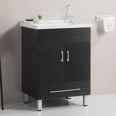 a bathroom vanity with a sink and towel rack