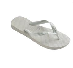 Havaianas Top Flip Flops (Little Kid/Big Kid/Adult) ﻿The Top flip flop is a summer staple. In three classic colors, this iconic style will take them through beach days, pool days, and lazy hang around the neighborhood days. Featuring Havaianas signature rubber sole for comfort and a tonal logo for a monochrome look. Details Thong style Cushioned footbed with textured rice pattern and rubber flip flop sole Made in Brazil Rubber Flip Flops, Iconic Style, Pool Days, Boy Shoes, Instagram And Snapchat, Summer Staples, The Neighborhood, Gift Card Shop, Beach Days