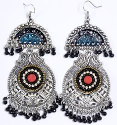 Intricately handmade by talented artisans in India, these tribal earrings are hand engraved and then set with beads and crystals and also lacquered in teal and black. Small black beads enhance the overall look. Since they have a long dangle they will enhance your neck.