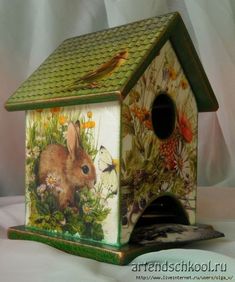 an image of a birdhouse with animals on it