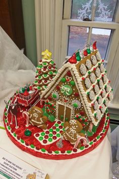 a decorated gingerbread house on top of a table