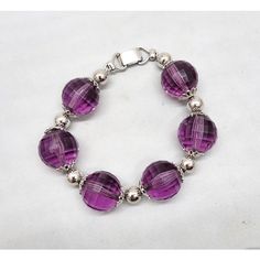 Early 1960s rhodium plated faceted purple resin beads with filigree detail terminals and round rhodium plated bead spacers and fold over clasp. Marked "NAPIER." Measures: 8 1/2 inches long by 3/4 inches wide. Interior circumference due to the thickness of the beads is about 7 1/4 inches. Excellent condition. Purple Resin, Resin Beads, Vintage 1960s, Fold Over, Rhodium Plated, Beaded Bracelet, 1960s, Beaded Bracelets, Bracelet