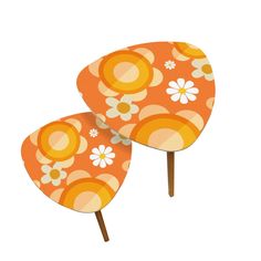 two orange and white flowers on wooden sticks