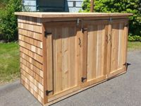 an outdoor bar made out of wooden boards