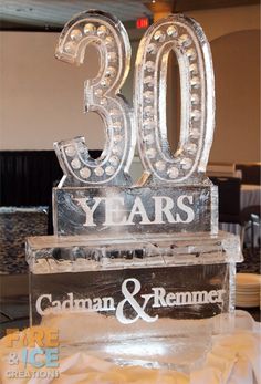 an ice sculpture that says 30 years and the number 50 is on top of it