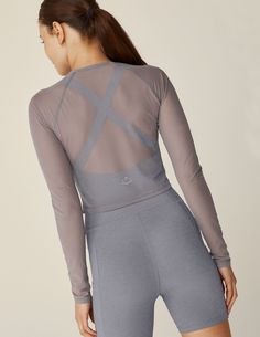 Make a subtle statement in this slightly sheer long sleeve cropped top, designed to layer on top of activewear, swimsuits, and more. With a soft, slinky feel that lets you feel cool and comfortable even on hot days, while offering that little bit of extra coverage you crave after your swim or workout is over.  Raglan sleeve Self binding at neck Fitted Cropped length Uniquely created to flatter every shape Every style we produce is wear-tested on our in-house team to ensure the best fit in every size Cute Activewear, Unique Workout Clothes, Mesh Activewear, Long Sleeve Cropped Top, Cozy Sleepwear, Sheer Long Sleeve, Activewear Fashion, Mesh Long Sleeve, Running Tops