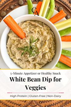 white bean dip for veggies in a bowl with carrots and celery