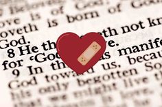 a red heart shaped object on top of a bible page with the words god, he is not afraid for god's manific