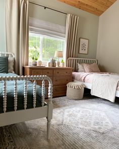 Kids bedroom with two spindle beds Girls Room 2 Beds, 2 Bed Bedroom Design, Shared Bedroom Boy And Girl Toddler, Neutral Twin Bedroom, Girl Bedroom Ideas Toddler, Neutral Shared Bedroom, Toddler Boy Girl Shared Room Ideas, Kids Bedroom 2 Beds, Sister Bedroom Ideas Toddler