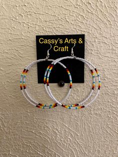 These hoops are doubled layered. They are light weight. Made out of seed beads. If you got any questions just message us. Thanks for looking at our page. We also have some clearance items or raffles on are Facebook group pages. Come check us out at Cassy's Native Selling & Auctions or Cassy's Native Beadwork & Apparels. Adjustable White Hoop Earrings For Festivals, White Hoop Earrings For Festival, Handmade White Hoop Earrings For Festivals, Festival White Hoop Earrings With Colorful Beads, Festival Colorful Beaded White Hoop Earrings, White Hoop Earrings With Tiny Beads, Adjustable White Hoop Earrings With Colorful Beads, White Beaded Hoop Earrings With Tiny Beads, Handmade White Adjustable Wrap Earrings