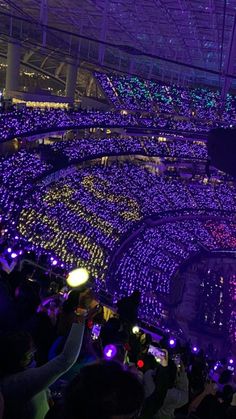 a large room filled with lots of purple lights