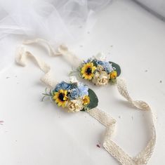 two bridal bouquets with sunflowers and ribbons