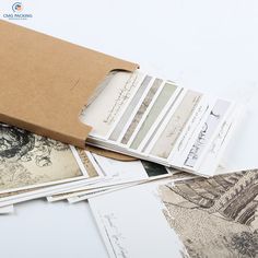 an open box filled with lots of different types of paper and pictures on top of each other