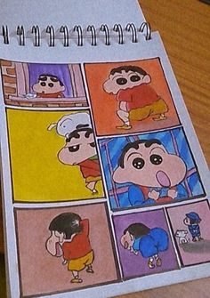 an open notebook with pictures of cartoon characters on it