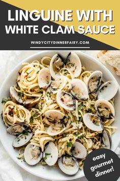 linguinne with white clam sauce in a bowl on top of a table