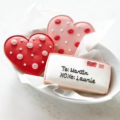 three heart shaped cookies in a bowl with the words, the world's most famous