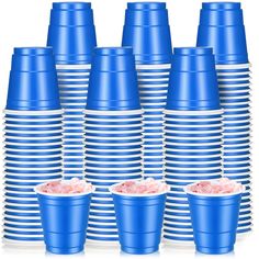 stacks of blue plastic cups with pink sugar in them