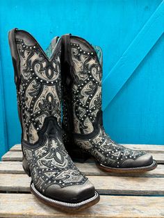 Exhibit your bold cowgirl style with Corral Women's Black Laser Embroidered & Studs Square Toe Cowgirl Boots, showcasing intricate embroidered detailing and studded accents. Authentic Cowgirl Style Cowhide Leather Vamp Pig Leather Lining Square Toe 12" Shaft Height Macocel 1.5" Cowboy Heel Leather Sole Goodyear Welt Construction Color: Black And Grey Embroidered Snip Toe Boots For Rodeo, Western Style Embroidered Boots, Western Hand Tooled Boots For Festivals, Western Embroidered Boots For Festivals, Hand Tooled Western Boots For Festival, Western Style Embroidered Boots For Festival, Western Style Embroidered Festival Boots, Embroidered Snip Toe Boots For Festival, Western Embroidered Boots For Rodeo