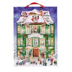 a christmas card with a green and white house in the snow on it's front