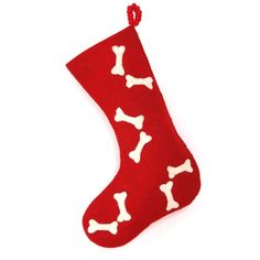 a red christmas stocking with white dog bones hanging from it's side on a white background