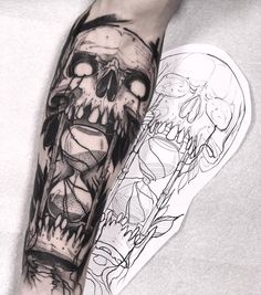 a man's leg with a tattoo on it that has an image of a skull