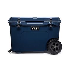 the yeti wheeled cooler is blue and has wheels that are black on each side