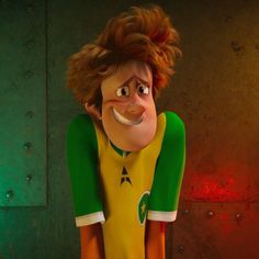 the animated character is wearing a green and yellow shirt with his mouth open, while standing in front of a wall