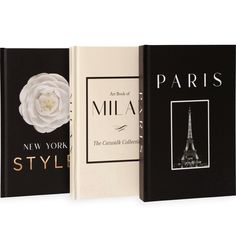 three new york style books with the eiffel tower in black and white cover