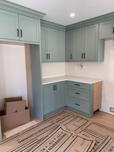 an empty kitchen is being remodeled with new cabinets and flooring in the process of being installed