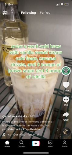 an image of a drink in a glass on a shelf with the caption below it