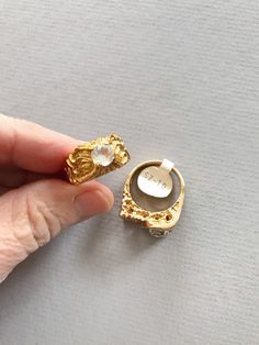 Super swanky PAIR of vintage 70's / 80's 18k / Kt heavy gold electroplate cubic zirconium / cz men's size 10 rings. One maintains the tag. Perfect for the gaudiest over the top wedding! In like new vintage condition. Size 10 Contact us with any questions, and please read our shop policies for full details. Vintage Gold-plated Gold Rings, Vintage Gold Plated Gold Rings, Hallmarked Gold Crystal Ring For Anniversary, Gold Hallmarked Crystal Ring For Anniversary, Vintage Gold Plated Wedding Rings, Gold Rings With Stone Setting For Anniversary, Unique Gold Topaz Ring For Formal Occasions, Vintage Yellow Gold Plated Signet Ring, Vintage Gold Plated Rings