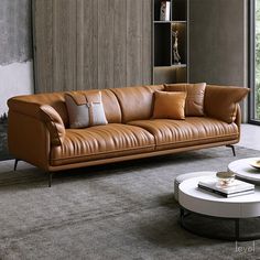 a brown leather couch sitting in a living room