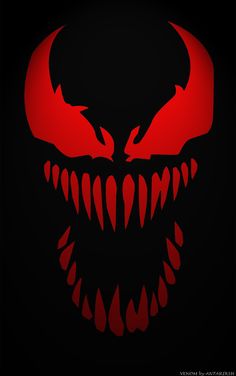 an evil face with red teeth and fangs on it's face, in the dark