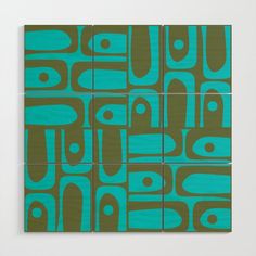 an abstract painting with blue and green colors on the side of a white square wall