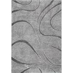 a gray rug with wavy lines on it